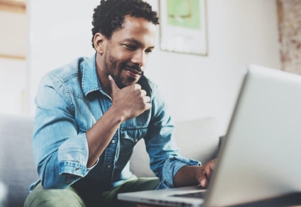 man looking at laptop