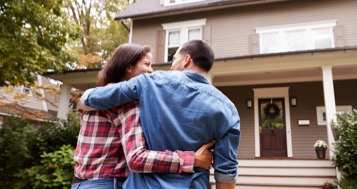 Couple entering home