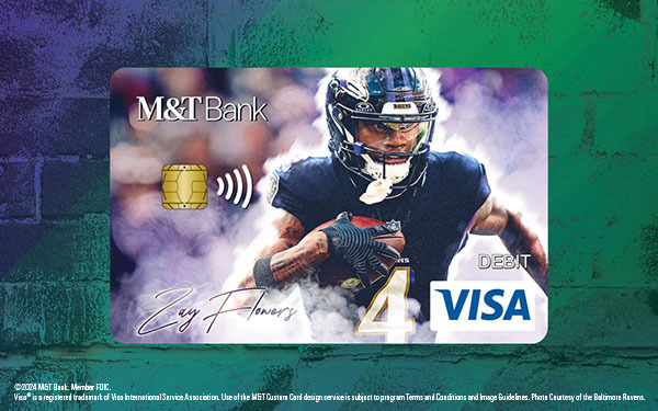 Zay Flowers holding a custom Baltimore Ravens debit card